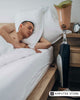 Amputee man sleeping beside his prosthetic leg — how quality sleep improves habit formation, recovery, and well-being.