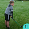 Freddie Tarr, a 10-year-old golf fan, tests Koalaa's new golf prosthetic arm.