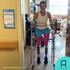 Lucinda Mullins, a quadruple amputee, walks on her prosthetic legs for the first time.