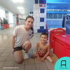 A seven-year-old boy with a double leg amputation learns how to swim.