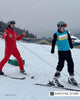 Ukrainian veteran with limb loss skiing with assistance, demonstrating adaptive skiing, rehabilitation, and return to sport after amputation.