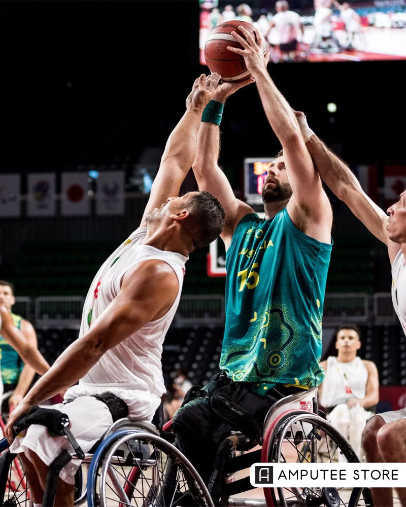 Wheelchair basketball players competing in adaptive sports game highlighting assistive technology and mobility equipment used by adaptive athletes.