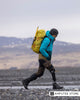 Man hiking across a rocky terrain wearing an Össur prosthetic foot with BASF Cellasto technology, showcasing improved comfort, energy return, and responsiveness.
