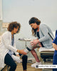A prosthetist fitting a woman's prosthetic leg during Health Empowerment Day checkup.