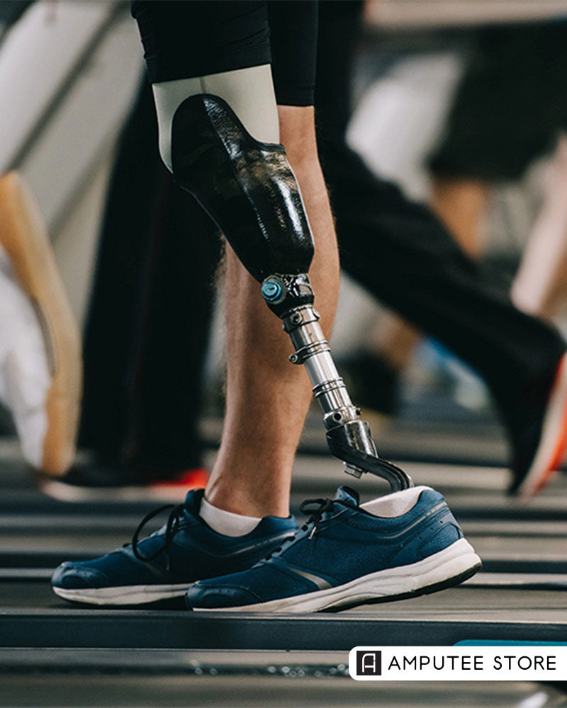 Person walking on a treadmill with an advanced prosthetic foot and athletic shoes. 