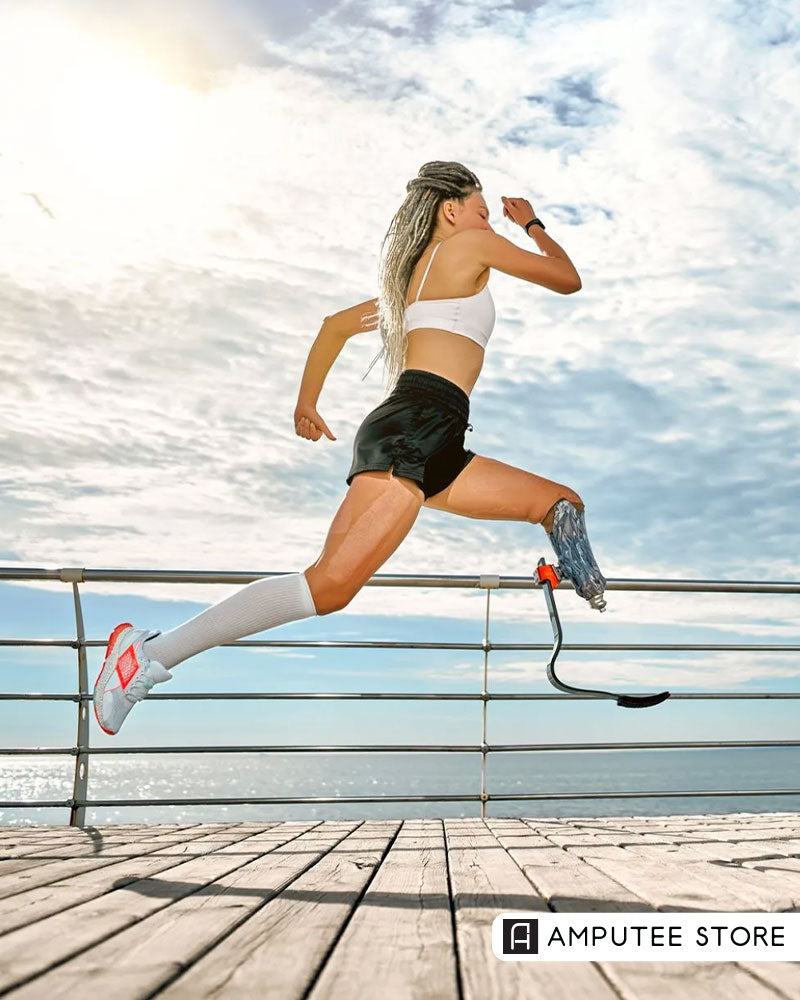 Female below-knee amputee runs outdoors with a blade prosthesis during hot weather beside the water.