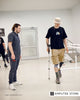 Photojournalist with a below-knee prosthetic leg practices walking with a crutch during rehabilitation after receiving mobility support funded by Kyiv Independent readers.
