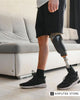 Below-knee amputee wearing a prosthetic leg, illustrating an article on a heat-control socket designed to improve comfort.
