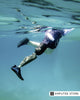 Swimmer with a lower-limb amputation uses a waterproof swimming prosthesis while exercising underwater in a pool.