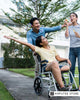 A woman in a wheelchair enjoying time outdoors with friends, illustrating lifestyle and health awareness about residual limb skin care for amputees.